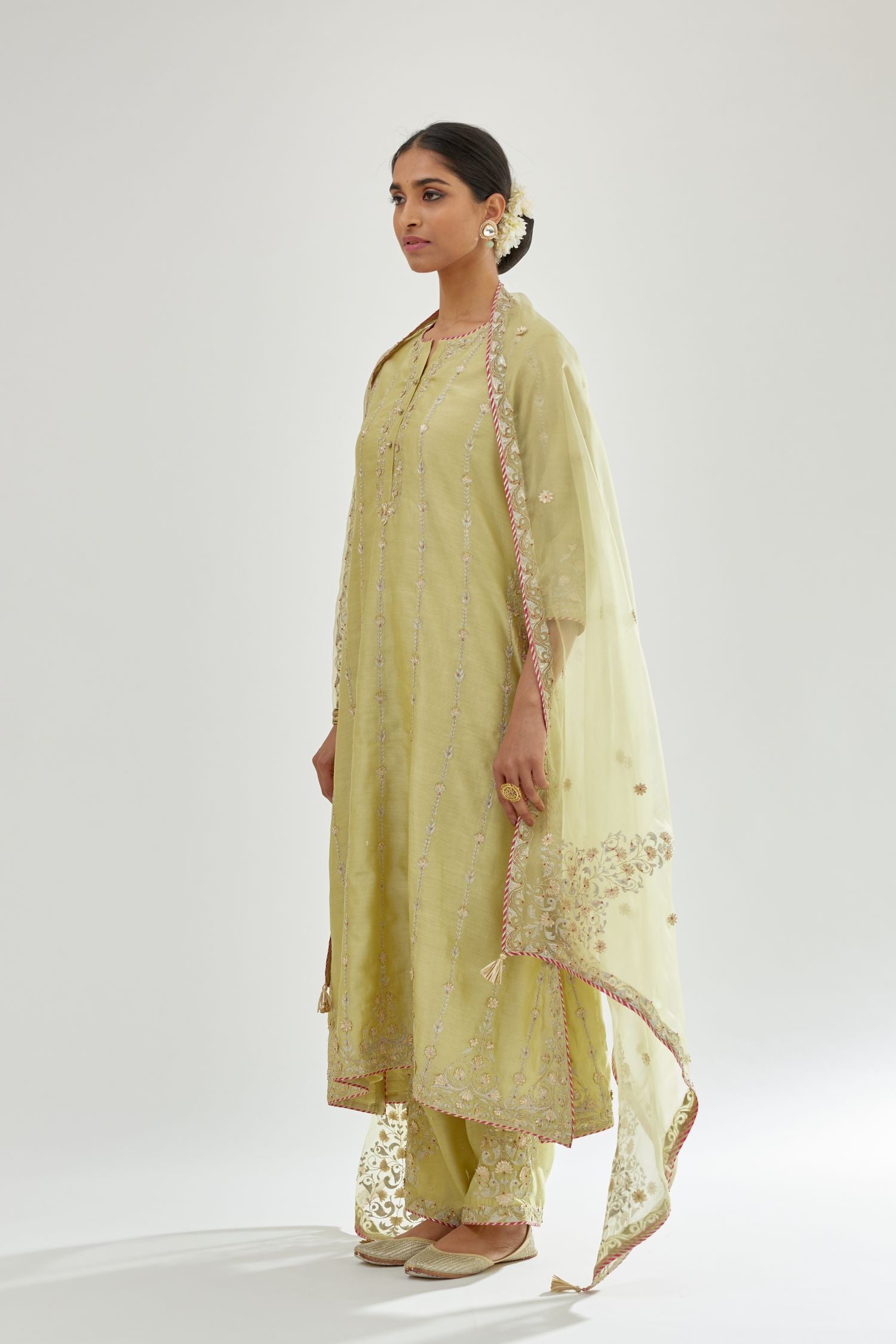 Green silk chanderi straight kurta set with all over heavy dori and gota embroidery work, highlighted with contrast bead work.