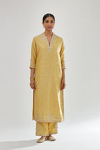 Yellow silk chanderi straight kurta set with zari, dori and gota embroidery, detailed with all-over delicate aari embroidery buties.