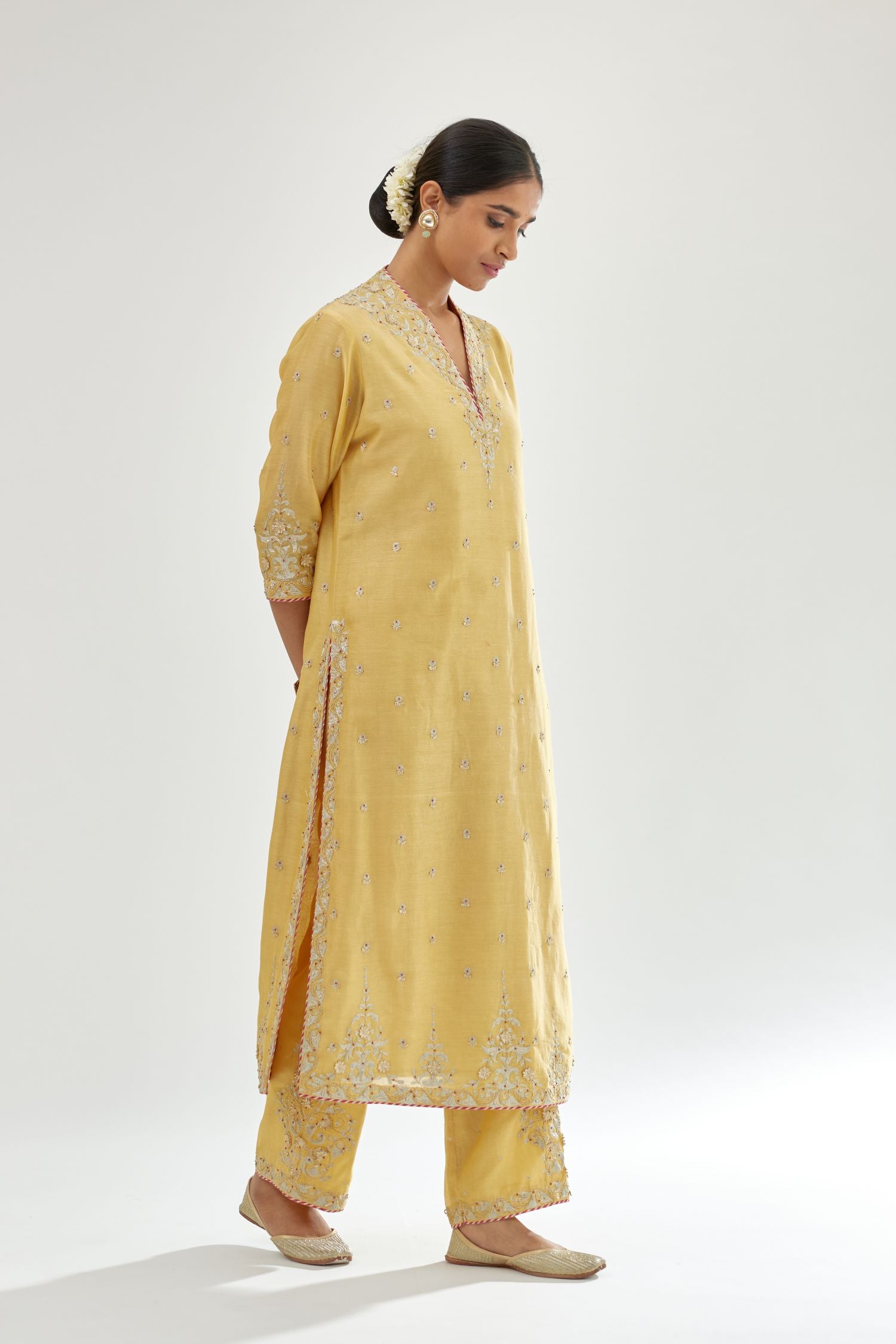 Yellow silk chanderi straight kurta set with zari, dori and gota embroidery, detailed with all-over delicate aari embroidery buties.