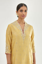 Yellow silk chanderi straight kurta set with zari, dori and gota embroidery, detailed with all-over delicate aari embroidery buties.