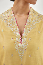 Yellow silk chanderi straight kurta set with zari, dori and gota embroidery, detailed with all-over delicate aari embroidery buties.