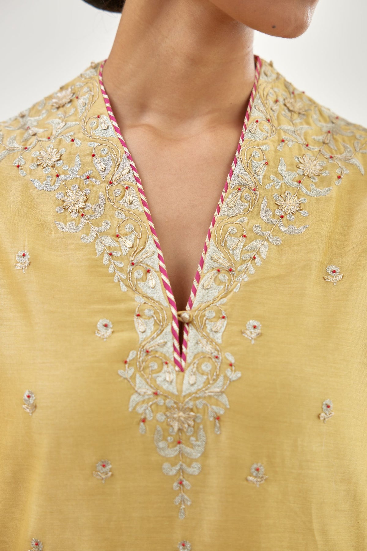 Yellow silk chanderi straight kurta set with zari, dori and gota embroidery, detailed with all-over delicate aari embroidery buties.