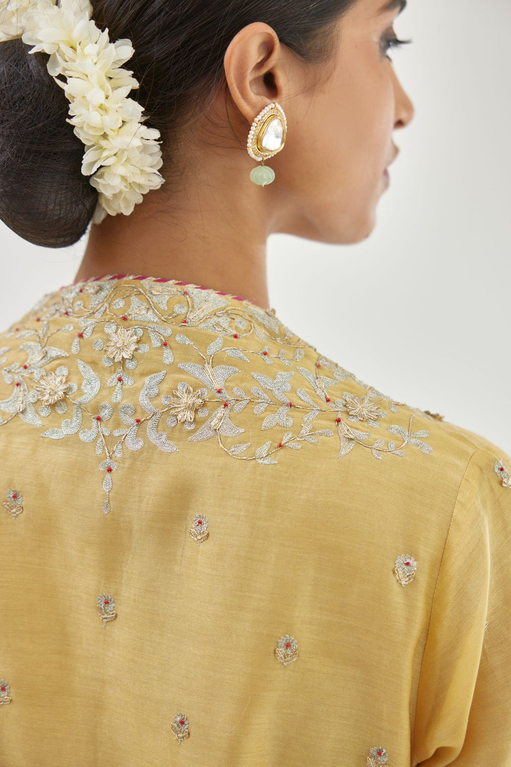 Yellow silk chanderi straight kurta set with zari, dori and gota embroidery, detailed with all-over delicate aari embroidery buties.