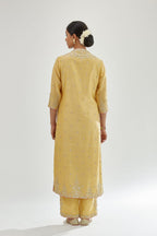 Yellow silk chanderi straight kurta set with zari, dori and gota embroidery, detailed with all-over delicate aari embroidery buties.