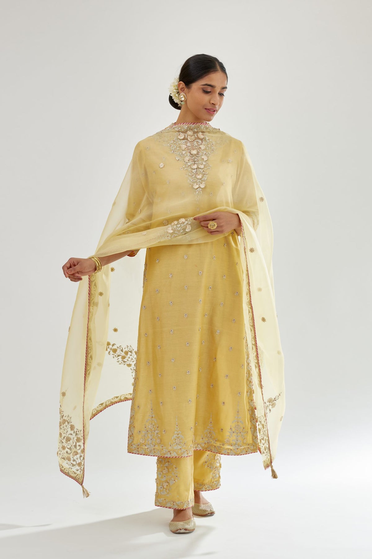 Yellow silk chanderi straight kurta set with zari, dori and gota embroidery, detailed with all-over delicate aari embroidery buties.