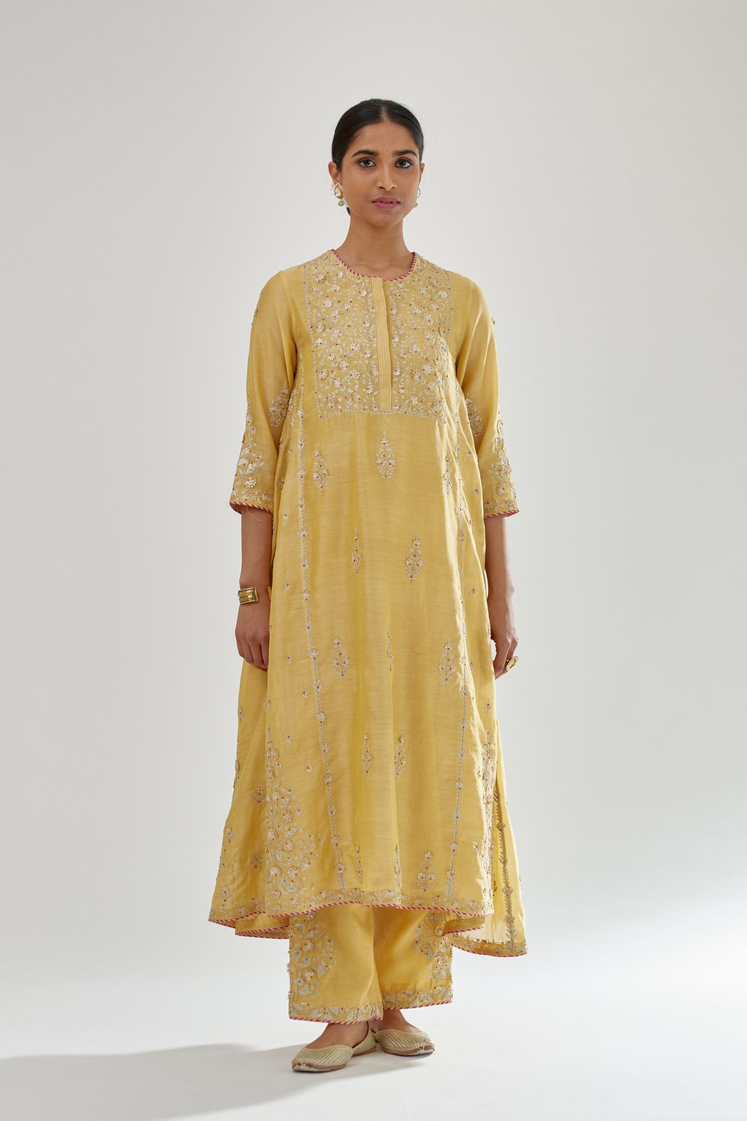 Yellow A-line long kurta set with all-over zari, dori, sequins and gota embroidery.