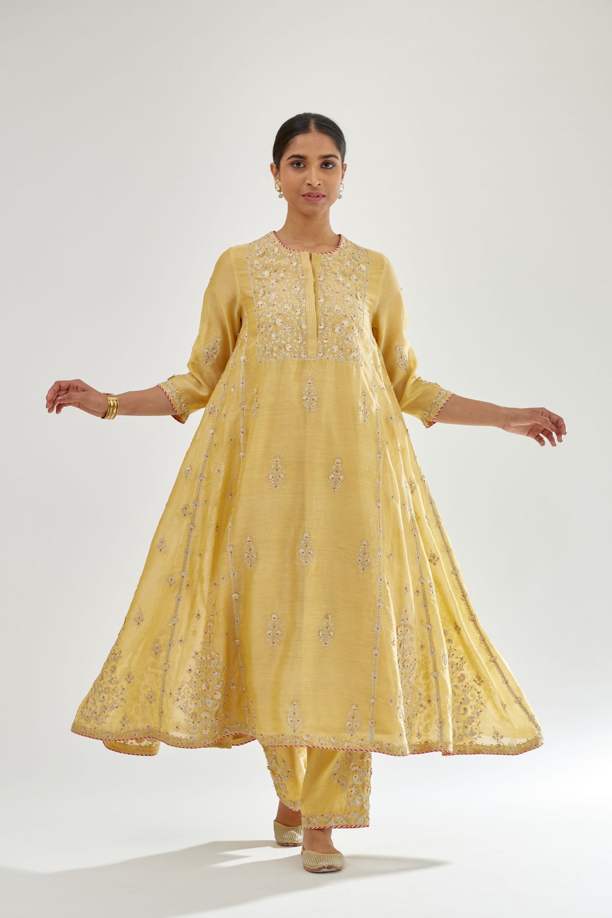Yellow A-line long kurta set with all-over zari, dori, sequins and gota embroidery.