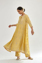 Yellow A-line long kurta set with all-over zari, dori, sequins and gota embroidery.