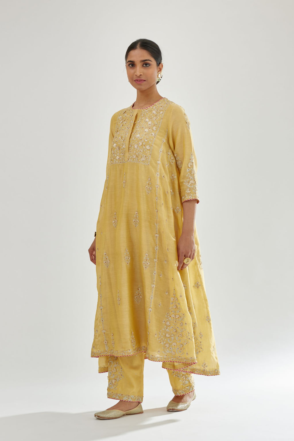 Yellow A-line long kurta set with all-over zari, dori, sequins and gota embroidery.