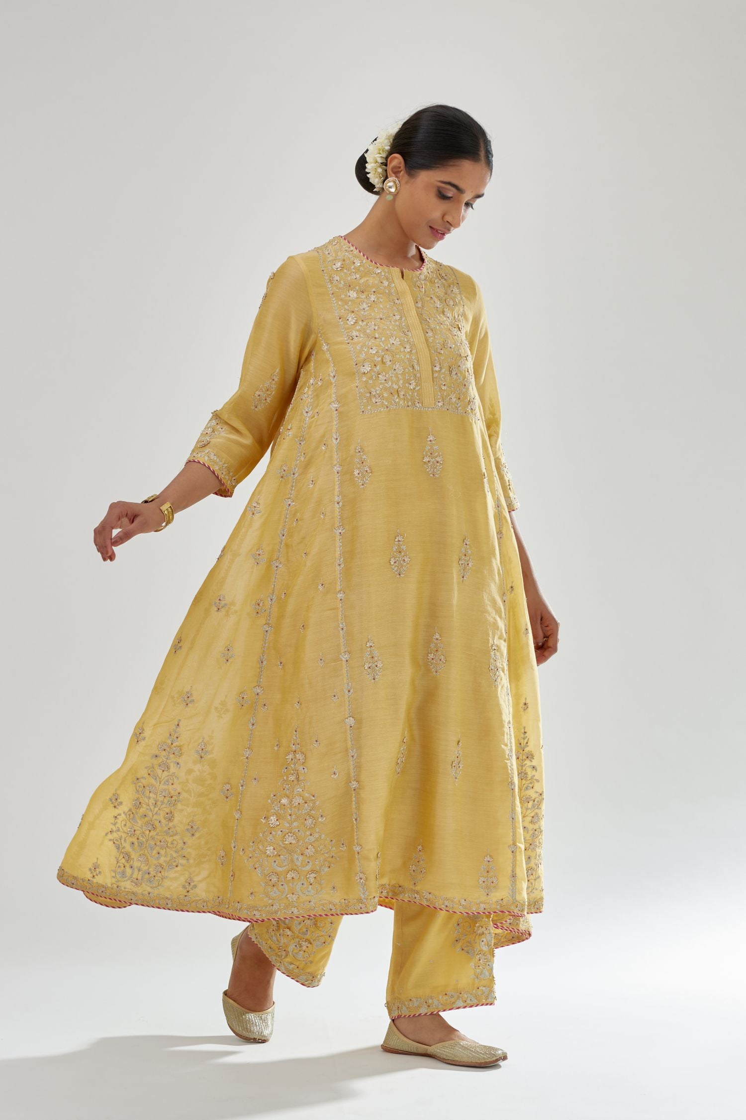 Yellow A-line long kurta set with all-over zari, dori, sequins and gota embroidery.