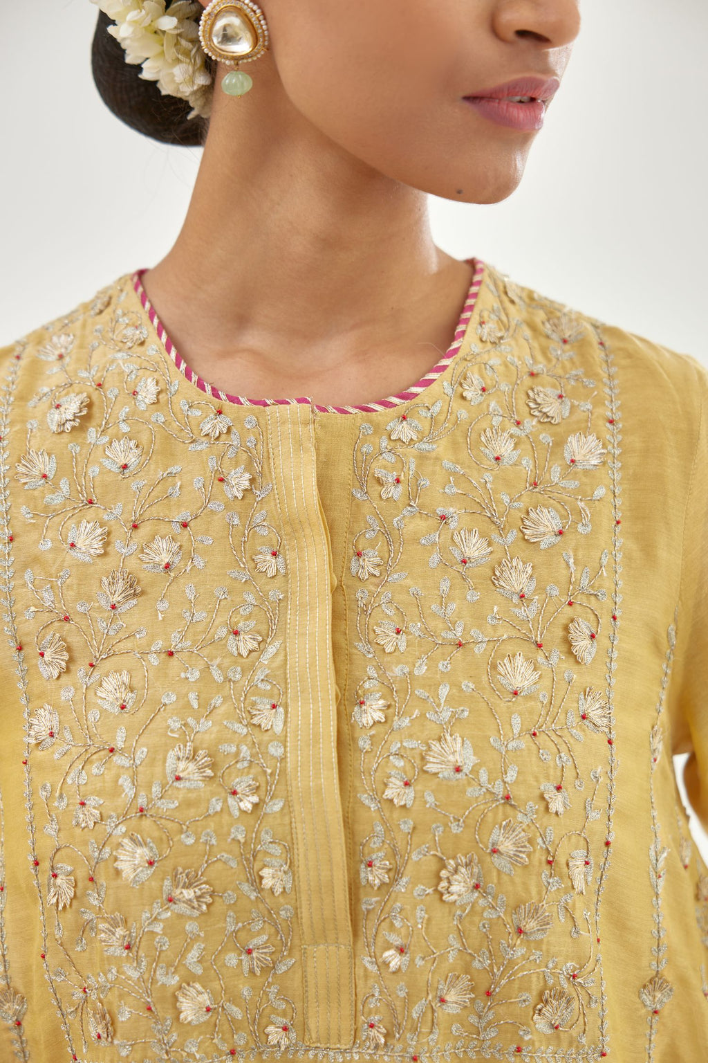 Yellow A-line long kurta set with all-over zari, dori, sequins and gota embroidery.