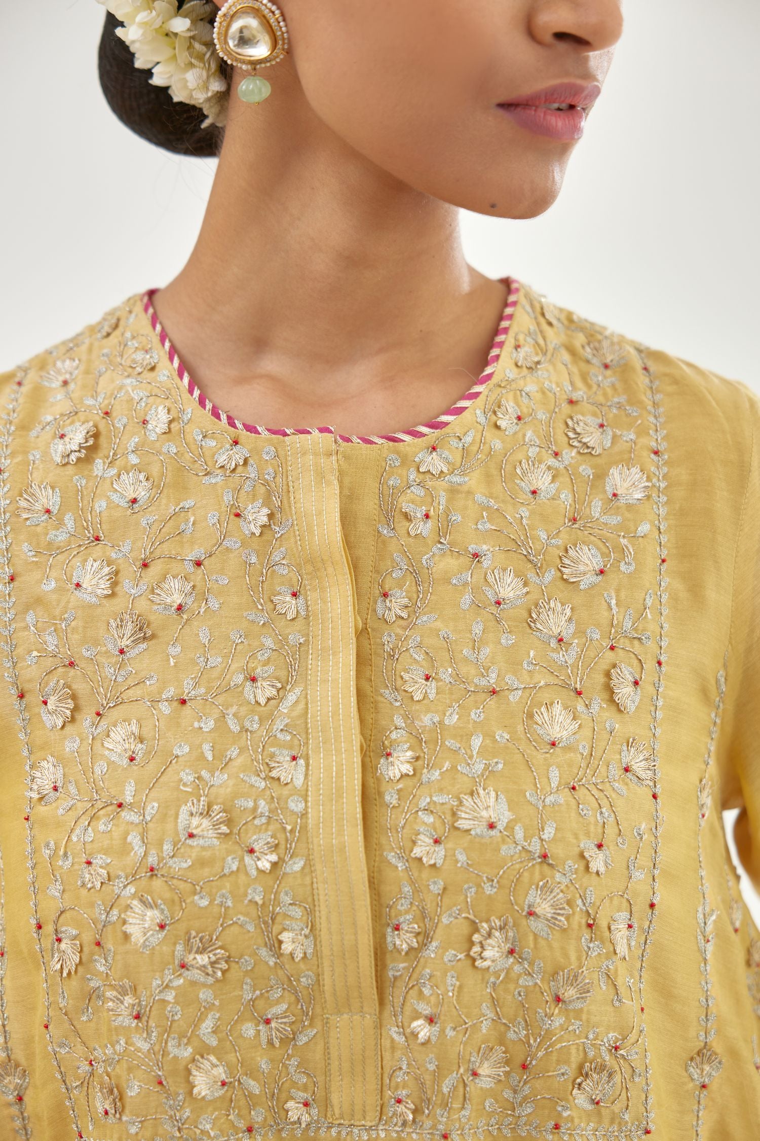 Yellow A-line long kurta set with all-over zari, dori, sequins and gota embroidery.