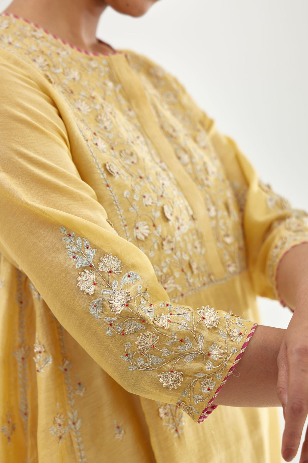 Yellow A-line long kurta set with all-over zari, dori, sequins and gota embroidery.