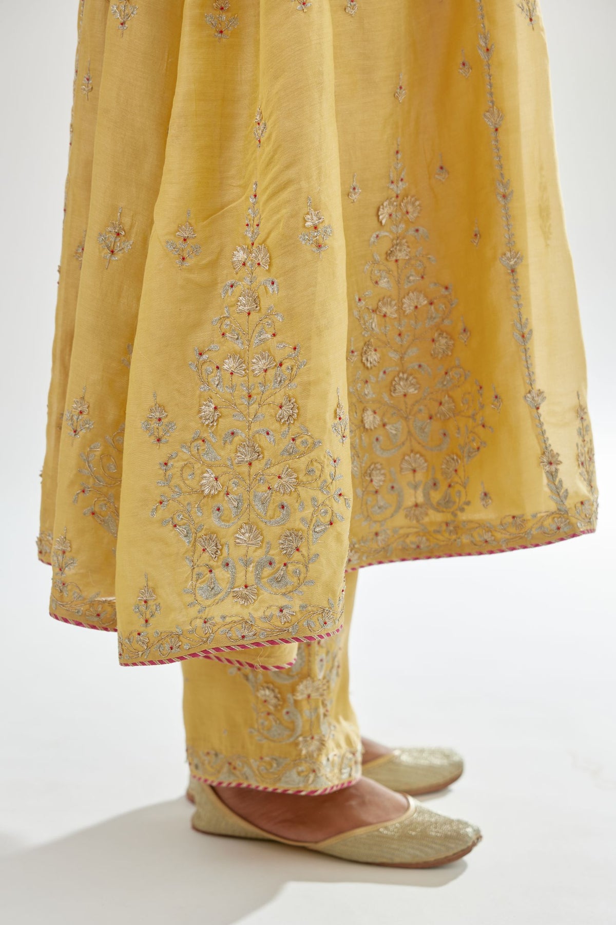 Yellow A-line long kurta set with all-over zari, dori, sequins and gota embroidery.