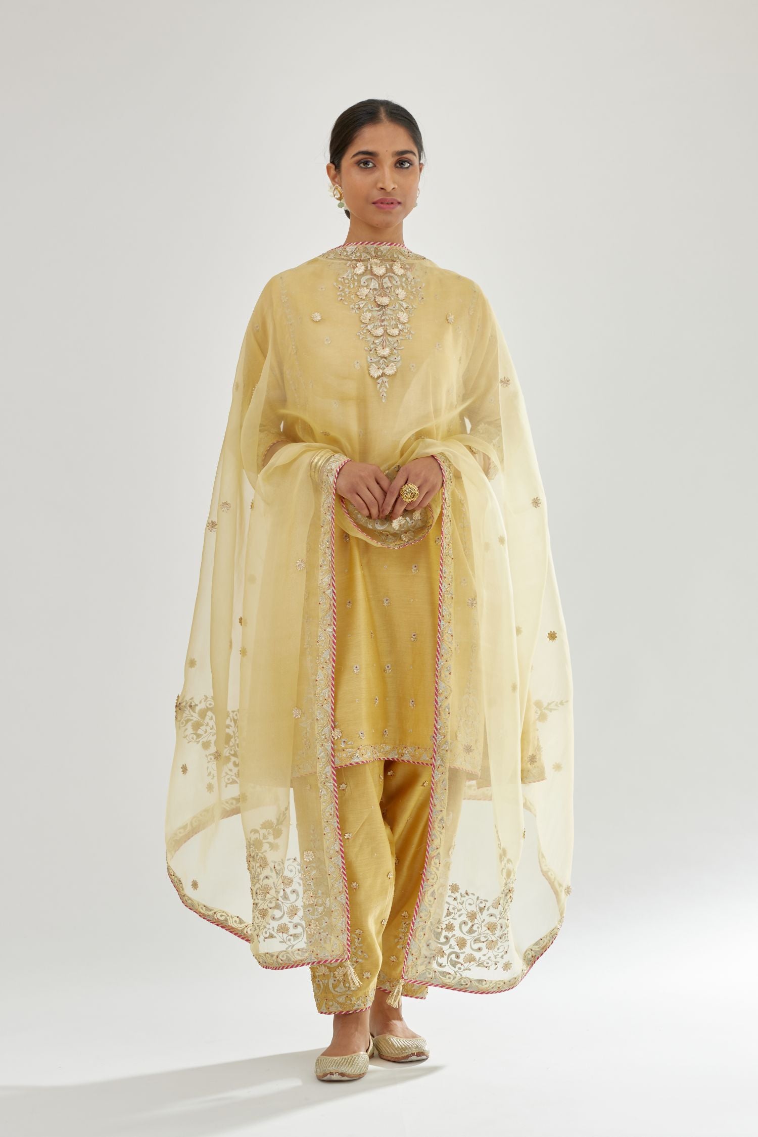 Yellow silk organza dupatta with dori and gota embroidery at edges, highlighted with contrast bead work.