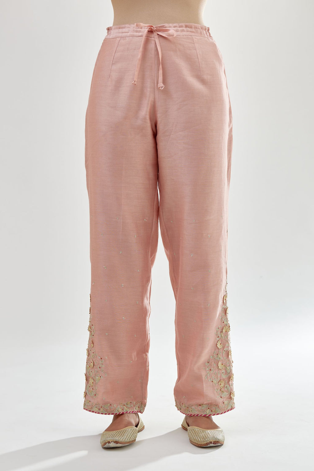 Pink silk chanderi straight pants, hem is detailed with zari, dori and gota embroidered boota at sides.
