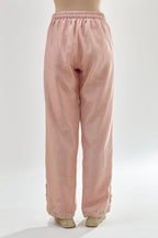 Pink silk chanderi straight pants, hem is detailed with zari, dori and gota embroidered boota at sides.