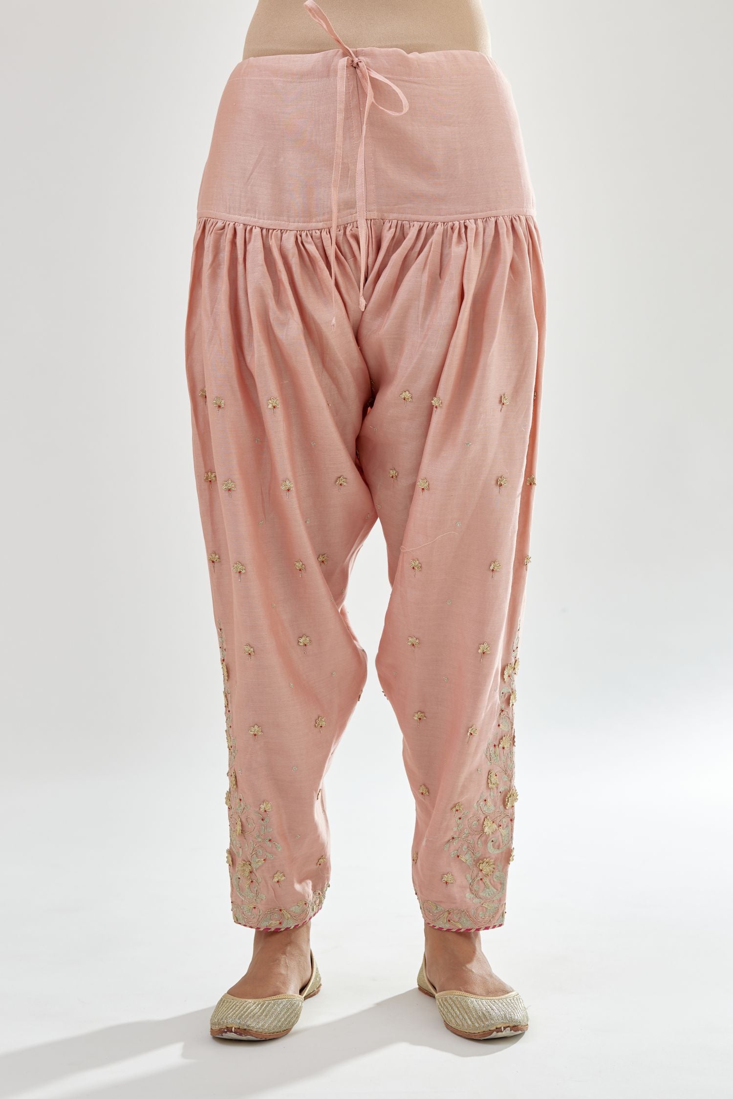 Pink silk chanderi salwar, detailed with zari, dori, bead and gota embroidered boota at sides.
