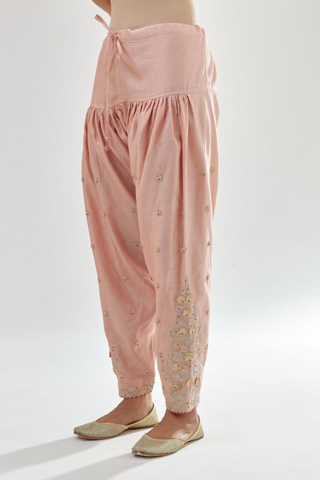 Pink silk chanderi salwar, detailed with zari, dori, bead and gota embroidered boota at sides.