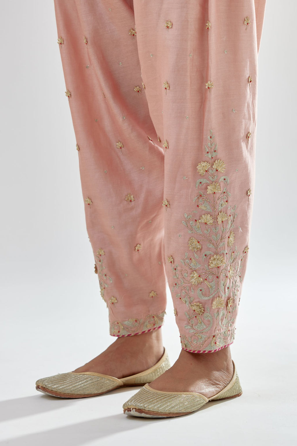 Pink silk chanderi salwar, detailed with zari, dori, bead and gota embroidered boota at sides.