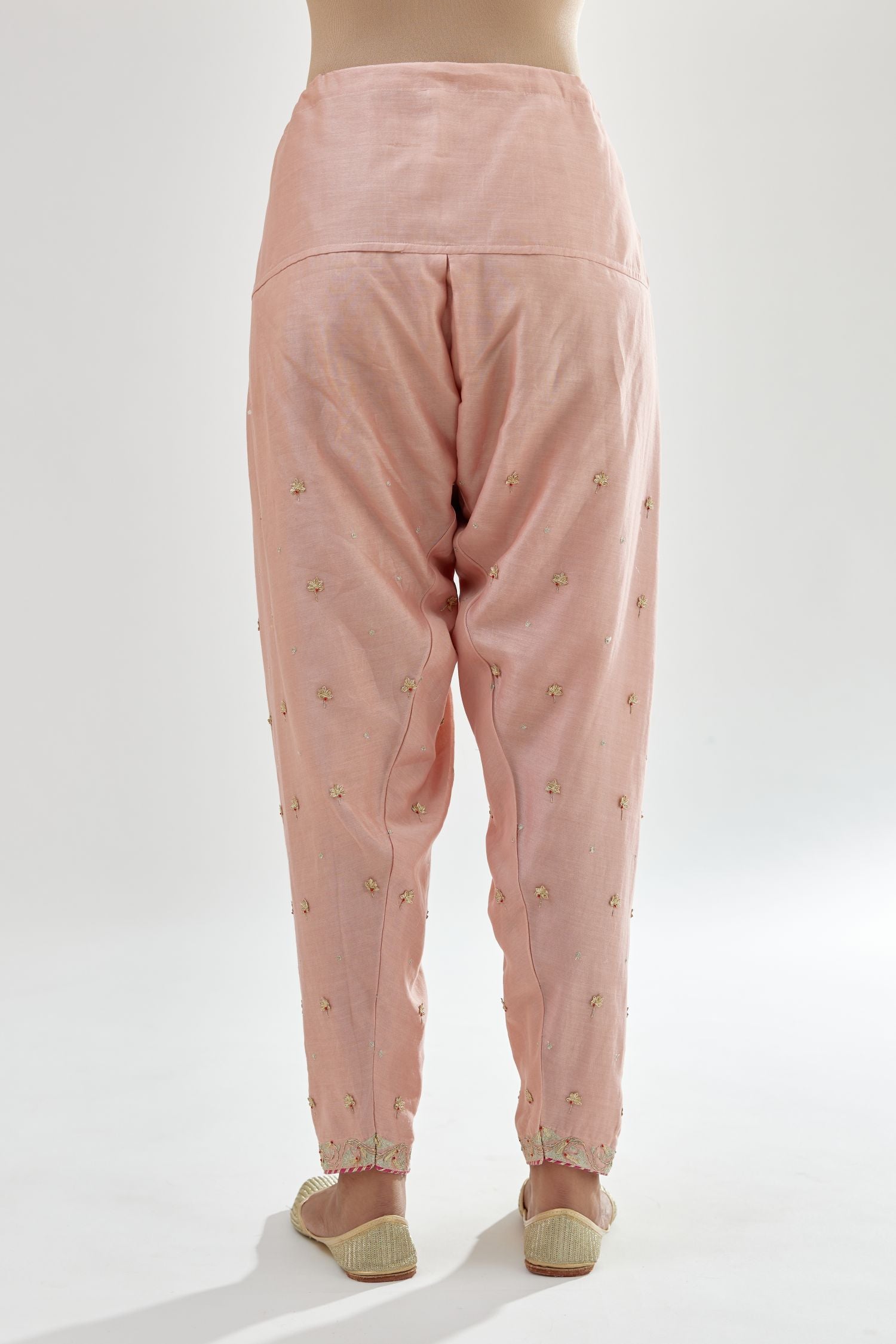Pink silk chanderi salwar, detailed with zari, dori, bead and gota embroidered boota at sides.