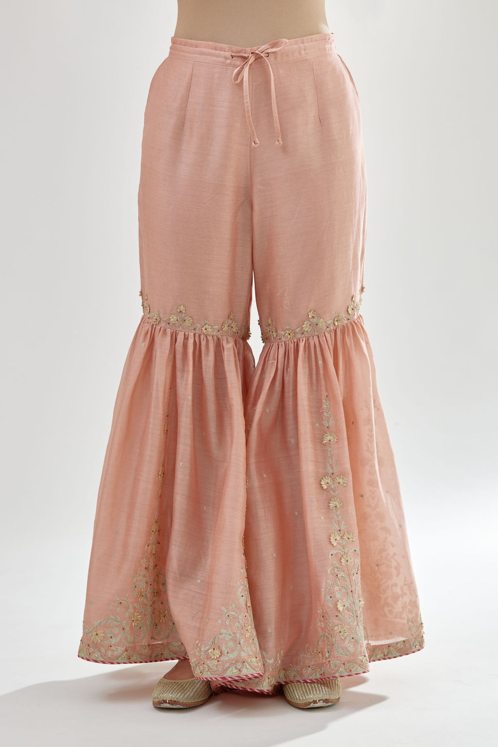 Pink silk chanderi farshi with gold zari, gota embroidery and gota detailing at knee joint seam.