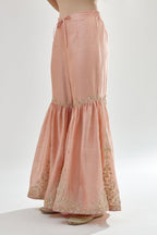 Pink silk chanderi farshi with gold zari, gota embroidery and gota detailing at knee joint seam.