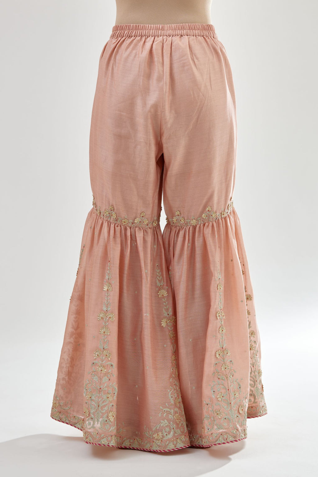 Pink silk chanderi farshi with gold zari, gota embroidery and gota detailing at knee joint seam.