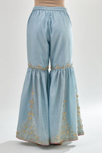 Blue silk chanderi farshi with gold zari, gota embroidery and gota detailing at knee joint seam.