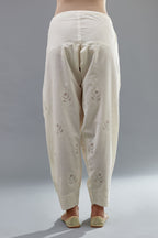 Off white cotton narrow salwar with all-over dori and silk thread embroidery.