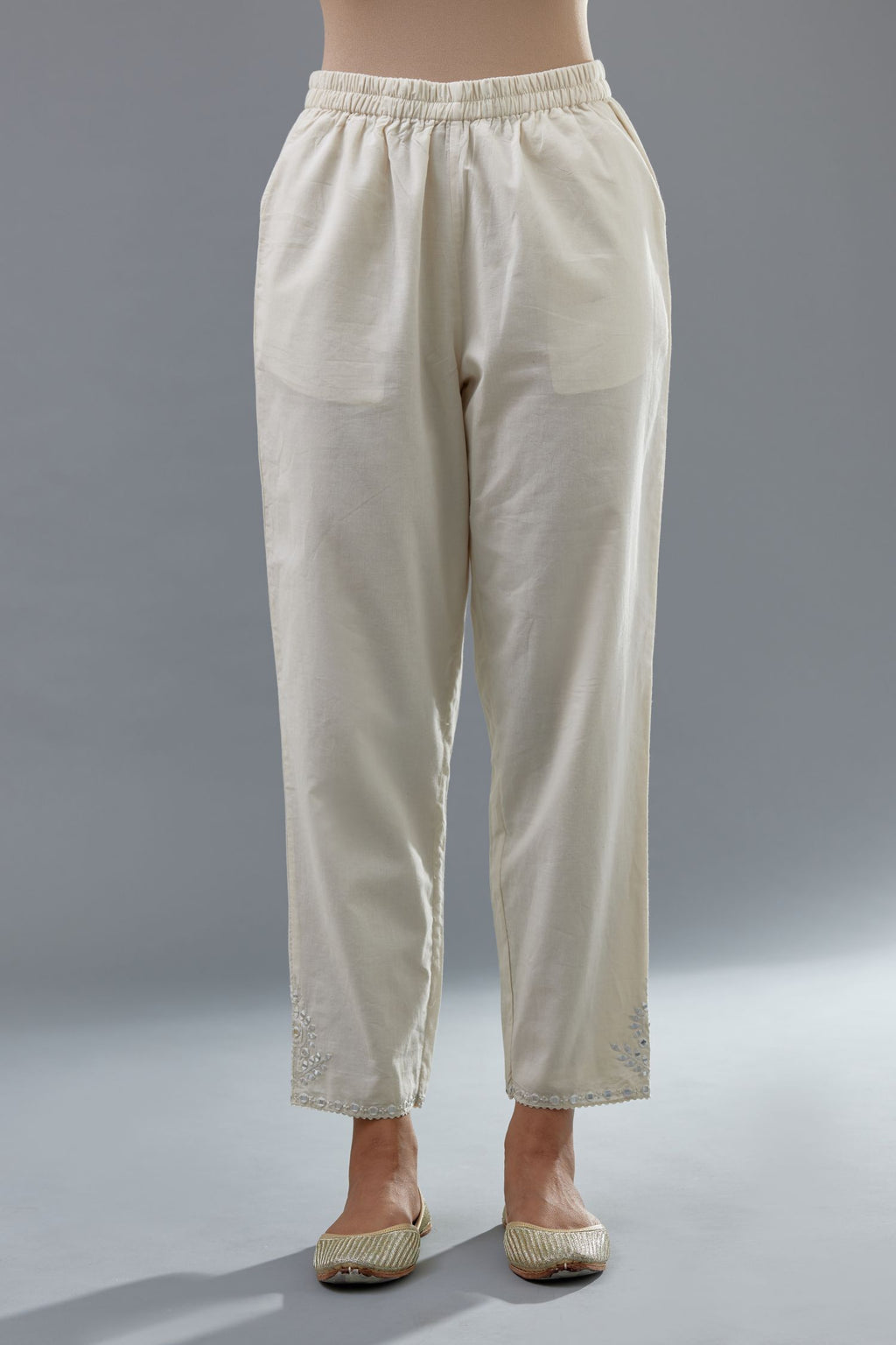Off white cotton comfortable fit pant with all-over elasticated waistband.