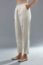 Off white cotton comfortable fit pant with all-over elasticated waistband.
