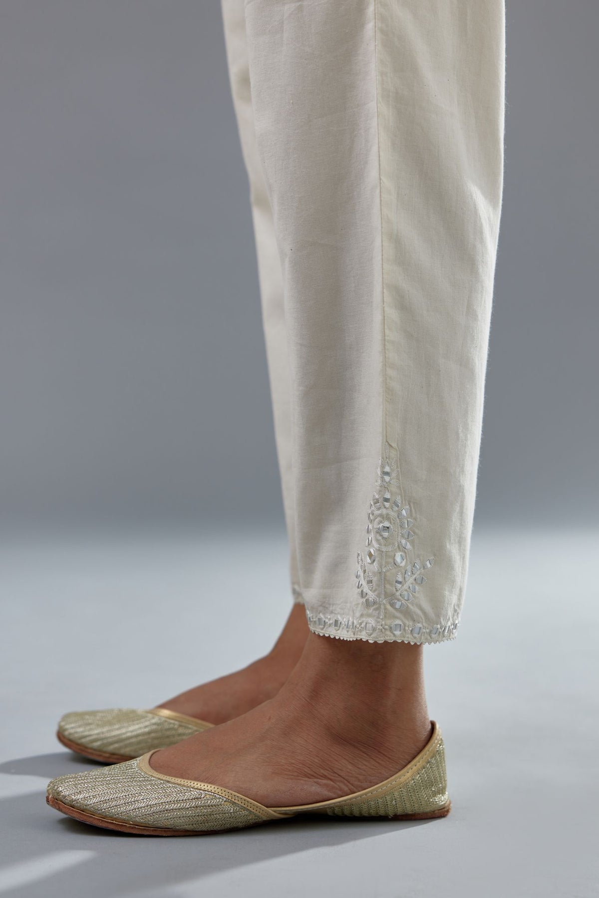 Off white cotton comfortable fit pant with all-over elasticated waistband.