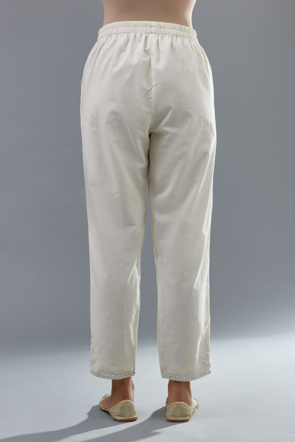 Off white cotton comfortable fit pant with all-over elasticated waistband.