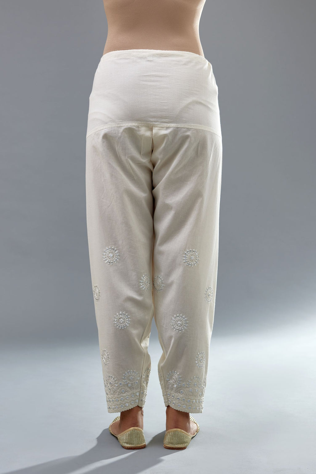 Off white cotton narrow salwar with all-over off white thread and mirror embroidery.