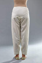 Off white cotton narrow salwar with all-over off white thread and mirror embroidery.