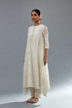 Off white A-line long kurta set with all-over tonal silk thread embroidery and cotton applique, highlighted with sequins work.