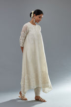Off white A-line long kurta set with all-over tonal silk thread embroidery and cotton applique, highlighted with sequins work.