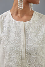 Off white A-line long kurta set with all-over tonal silk thread embroidery and cotton applique, highlighted with sequins work.