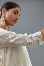 Off white A-line long kurta set with all-over tonal silk thread embroidery and cotton applique, highlighted with sequins work.