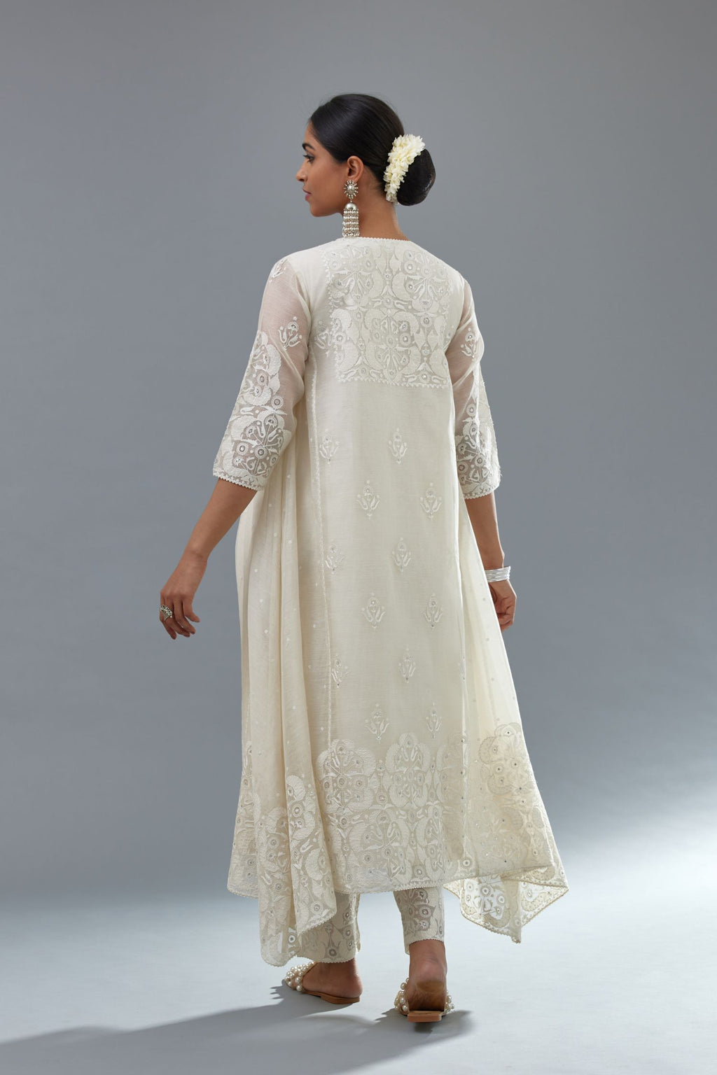 Off white A-line long kurta set with all-over tonal silk thread embroidery and cotton applique, highlighted with sequins work.
