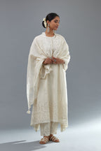Off white A-line long kurta set with all-over tonal silk thread embroidery and cotton applique, highlighted with sequins work.