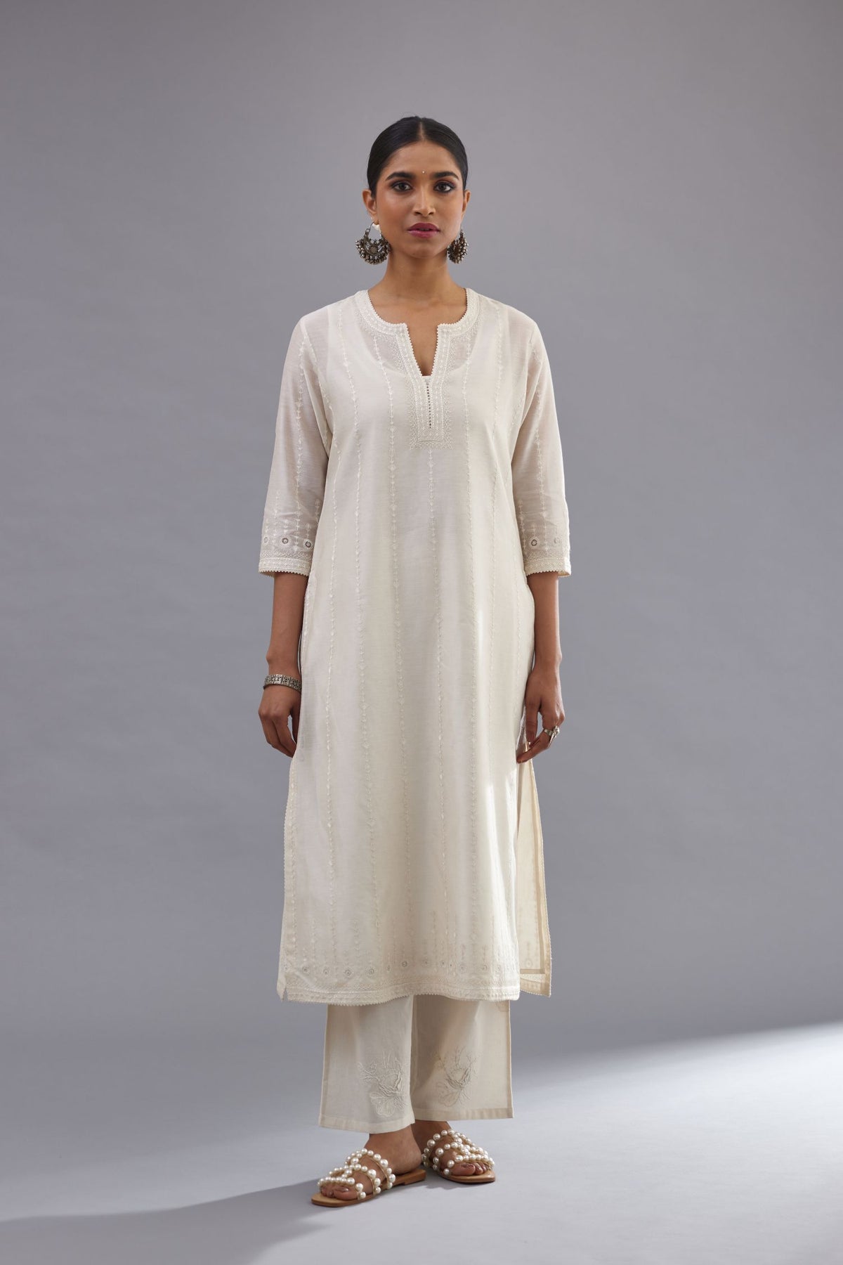 Off white silk chanderi straight kurta set with all over dori and silk thread embroidery.
