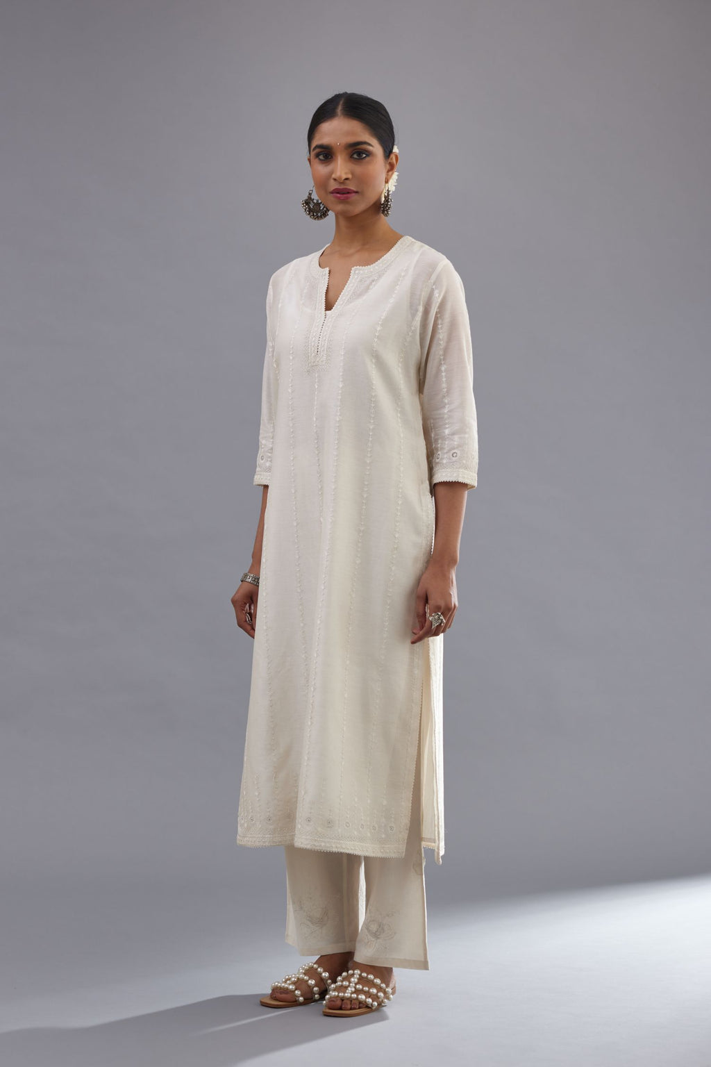 Off white silk chanderi straight kurta set with all over dori and silk thread embroidery.
