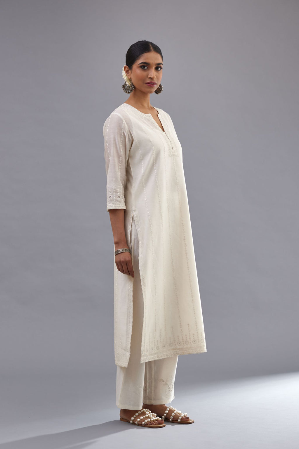 Off white silk chanderi straight kurta set with all over dori and silk thread embroidery.