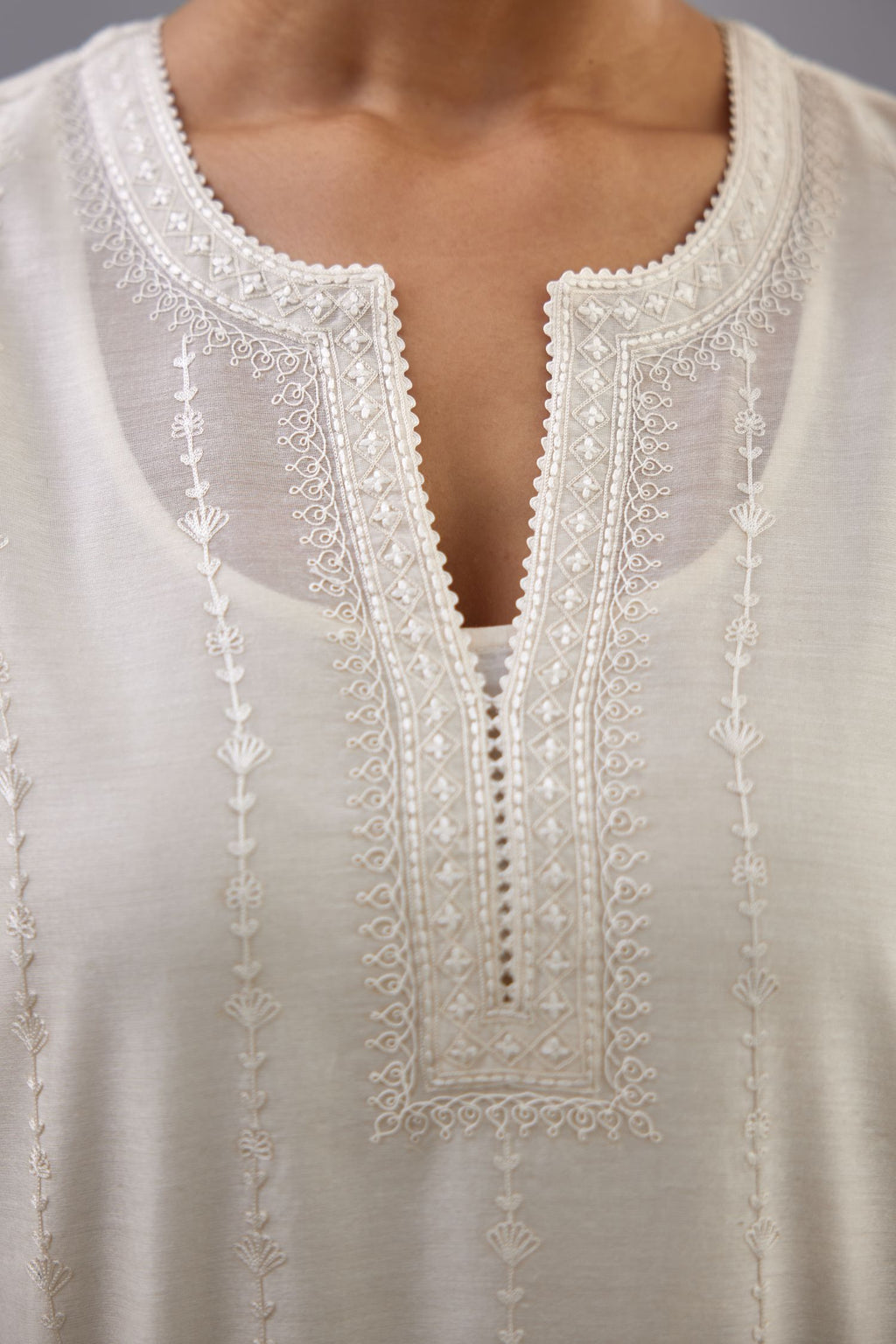 Off white silk chanderi straight kurta set with all over dori and silk thread embroidery.