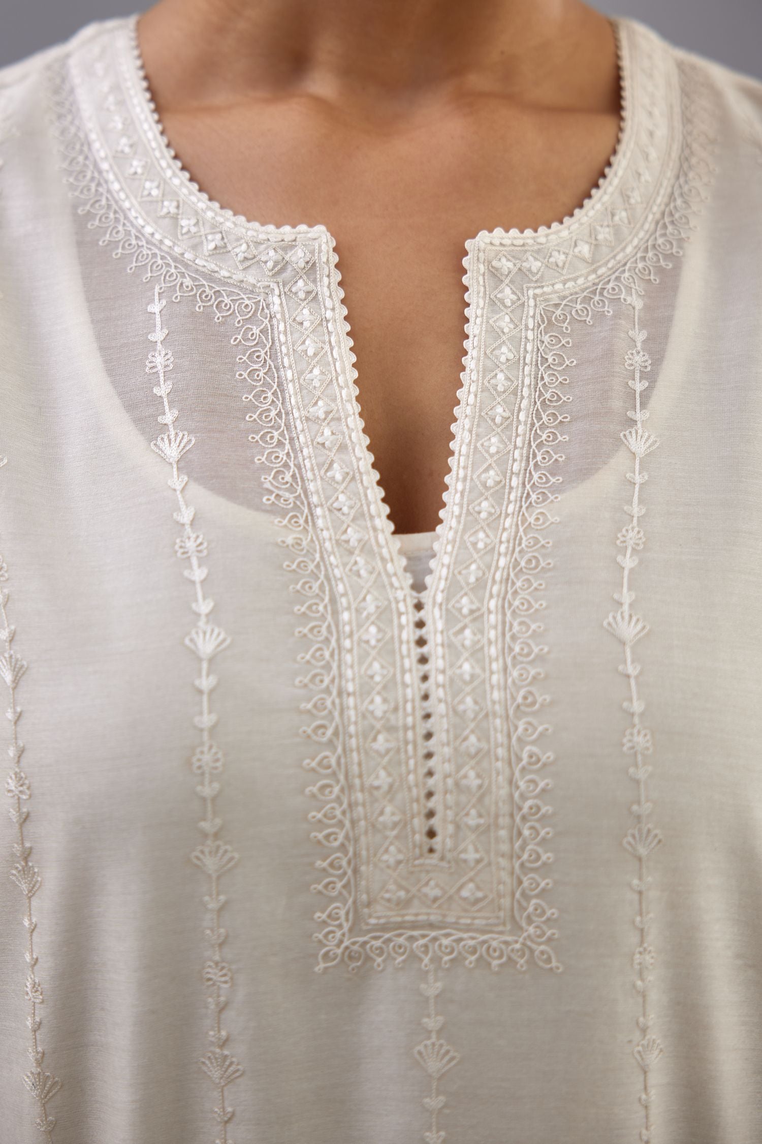 Off white silk chanderi straight kurta set with all over dori and silk thread embroidery.