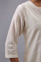 Off white silk chanderi straight kurta set with all over dori and silk thread embroidery.