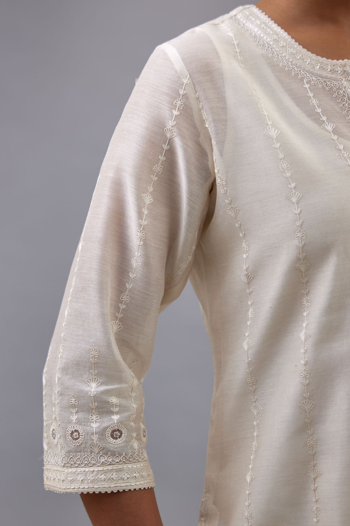Off white silk chanderi straight kurta set with all over dori and silk thread embroidery.