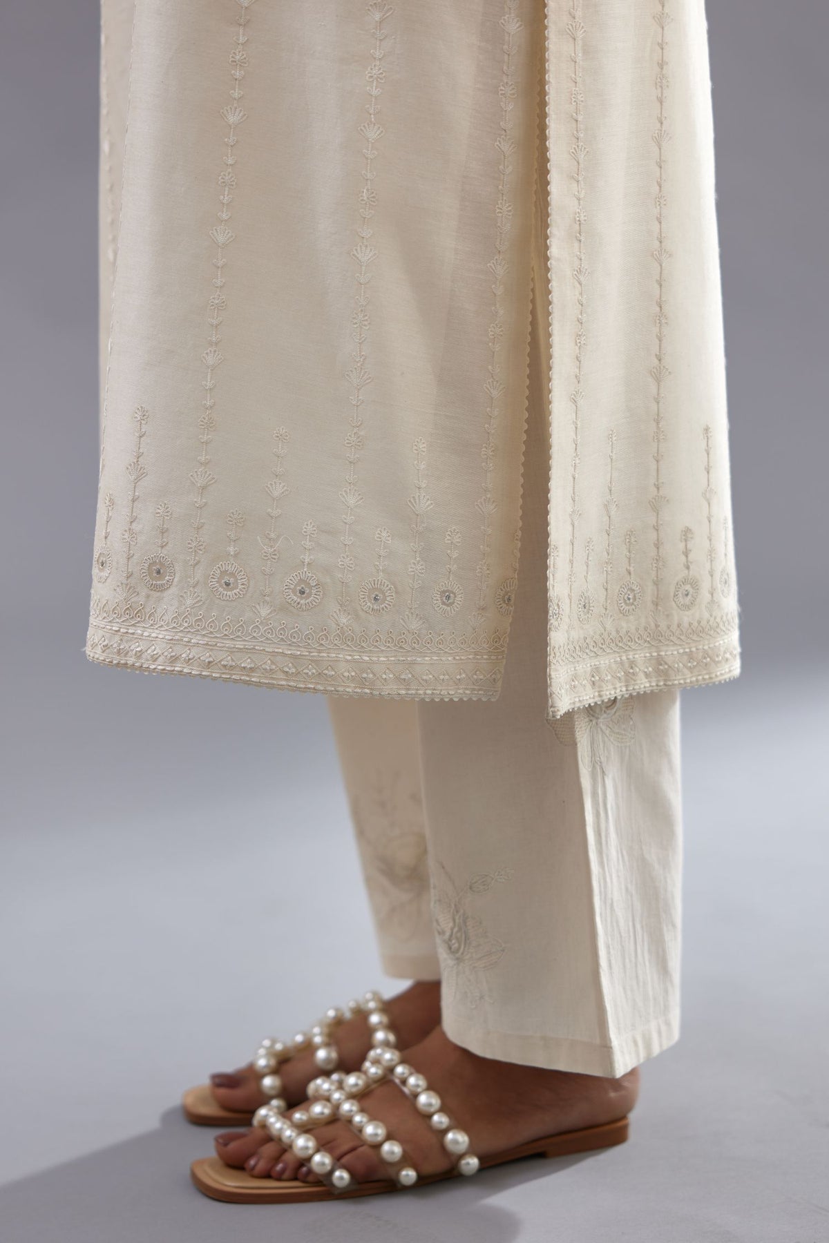 Off white silk chanderi straight kurta set with all over dori and silk thread embroidery.